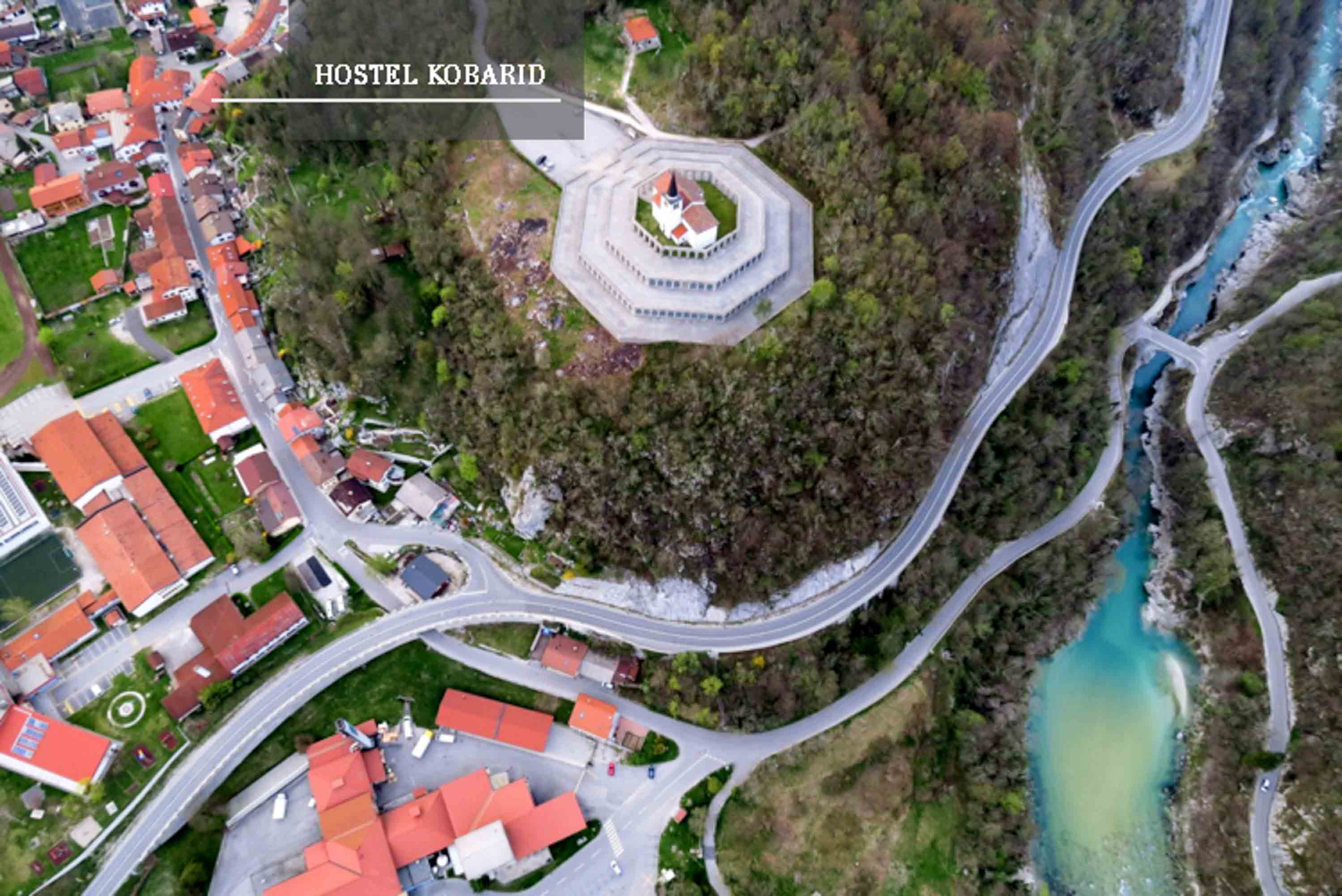 Spectacular view from the air showcasing Premium Hostel Kobarid's privileged location in the breathtaking Soca Valley